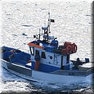 Met de vangst netjes opgeborgen na een dag hard werken weer op weg naar de haven van Peniche